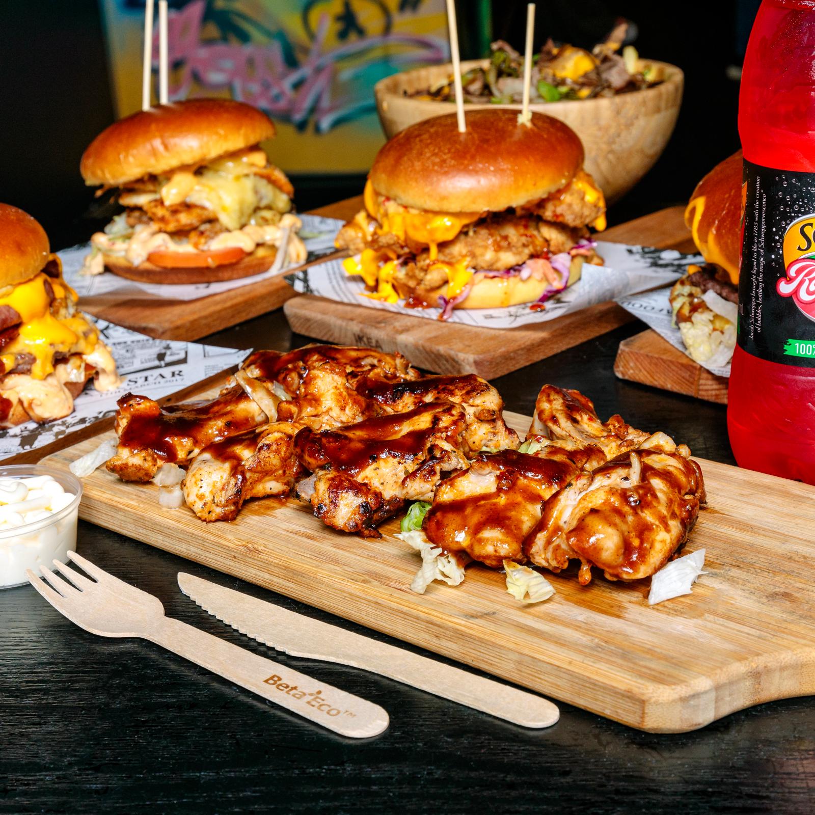 Grilled chicken wings platter with mini burgers and fries